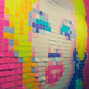A wall filled with Post-it notes at Valltech.